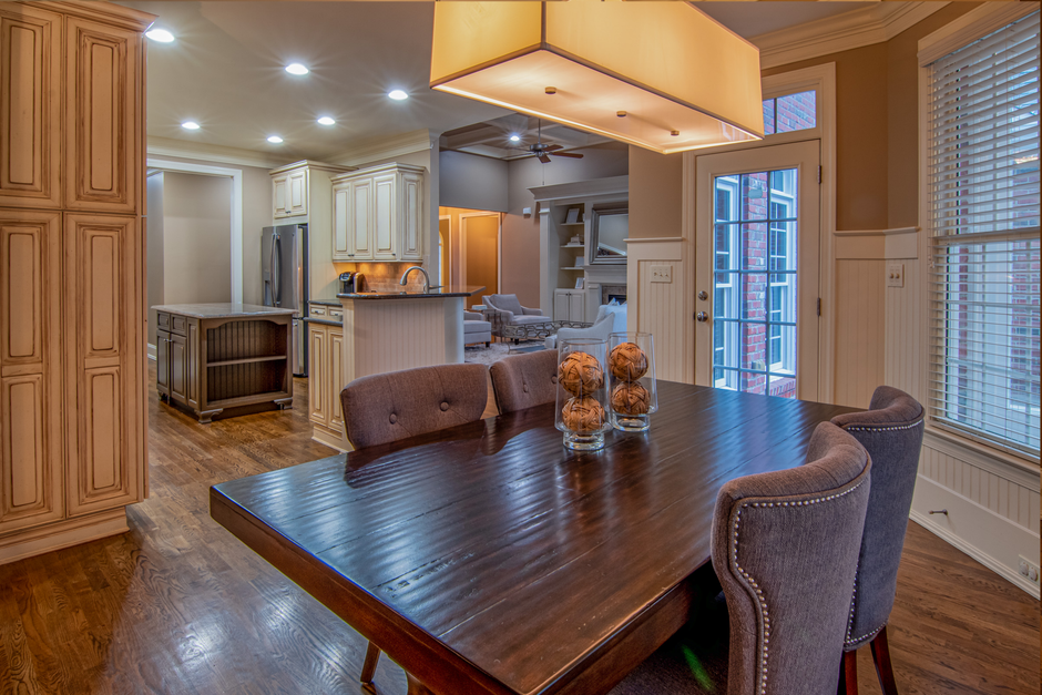 A cozy modern dining room with wooden table and chairs, highlighting contemporary interior design.